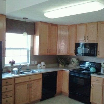 Kitchen (before): I settled, I know. But the builder was charging 12-G's for the cabinets I wanted so I took the builder's basic. It seemed outrageous at the time.