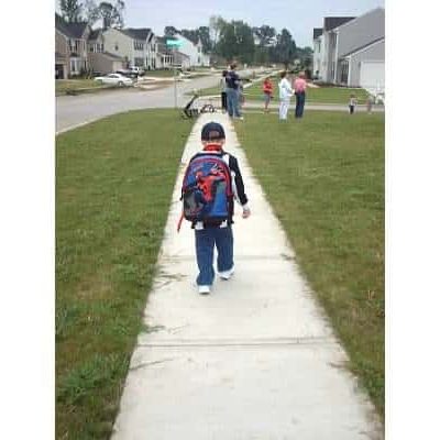 Ethan walking to bus stop 1st day of kindergarten