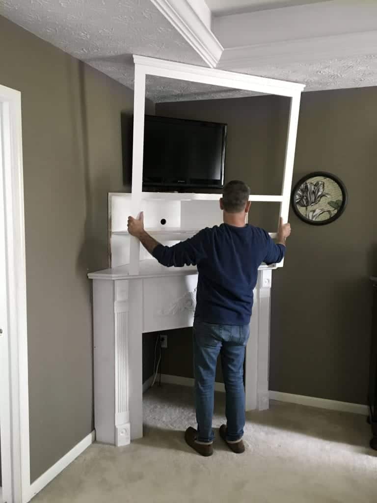 DIY Corner Fireplace Mantel framing it in