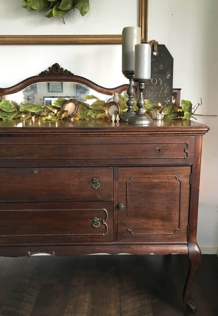 Queen Anne Buffet Before Repairs with Garland and holiday lights