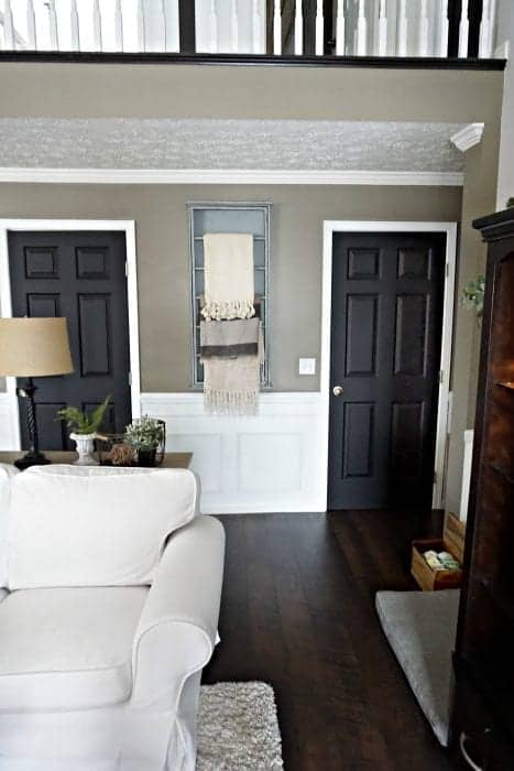 Modern Farmhouse Living Room View of Hallway Black Doors