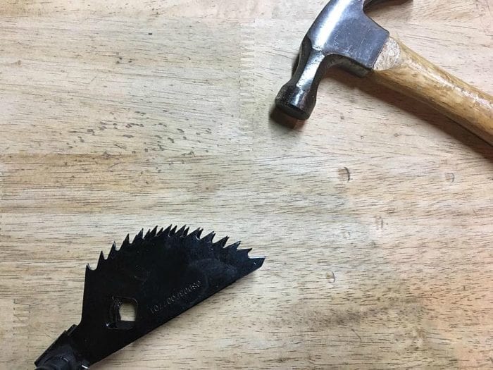 Distressed table using blade guard and hammer