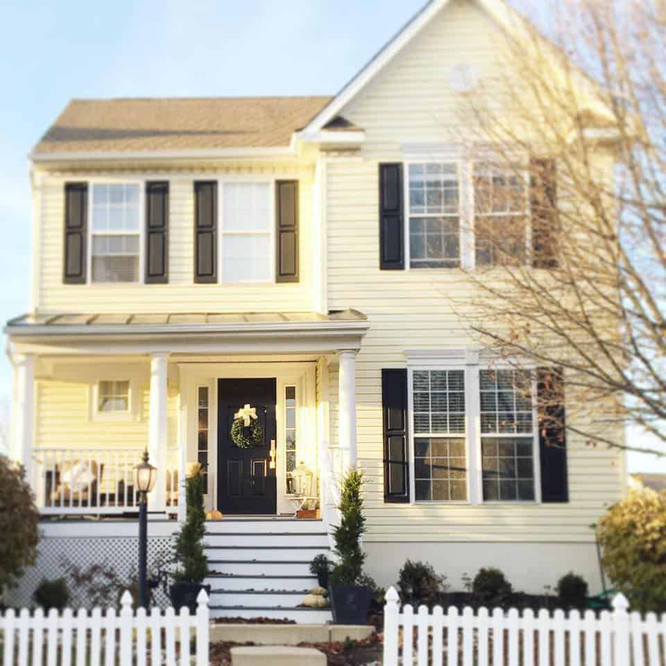 Yellow house with picket fence 