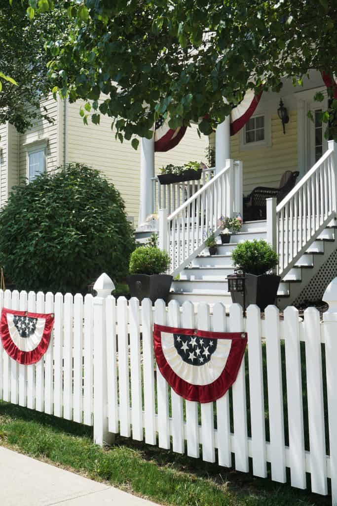 Patriotic Front Porch 2019 with White Picket Fence by SnazzyLittleThings.com