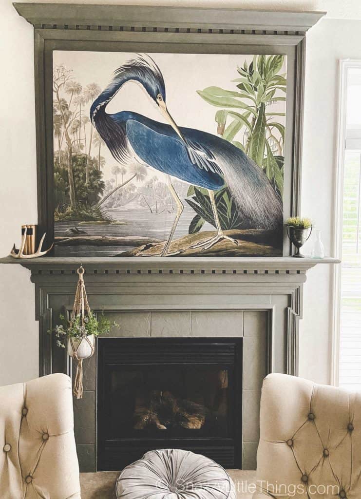 large scale wall art with wood frame over mantel