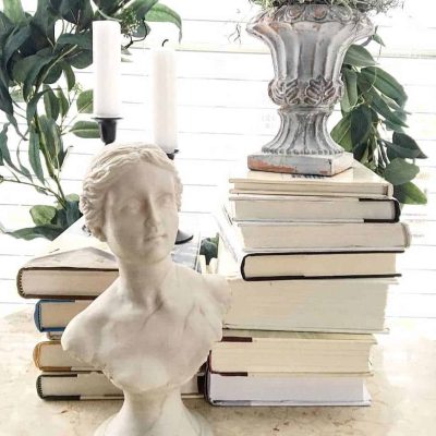 Thrifted Vintage Statue with Old Books, Old Candlesticks, Wreath