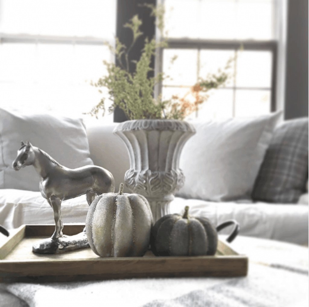 Thrifted Vintage vignette with pewter horse painted urn and pumpkins