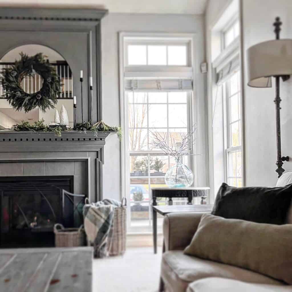 wood arch overlay on top of an existing mirror over mantel