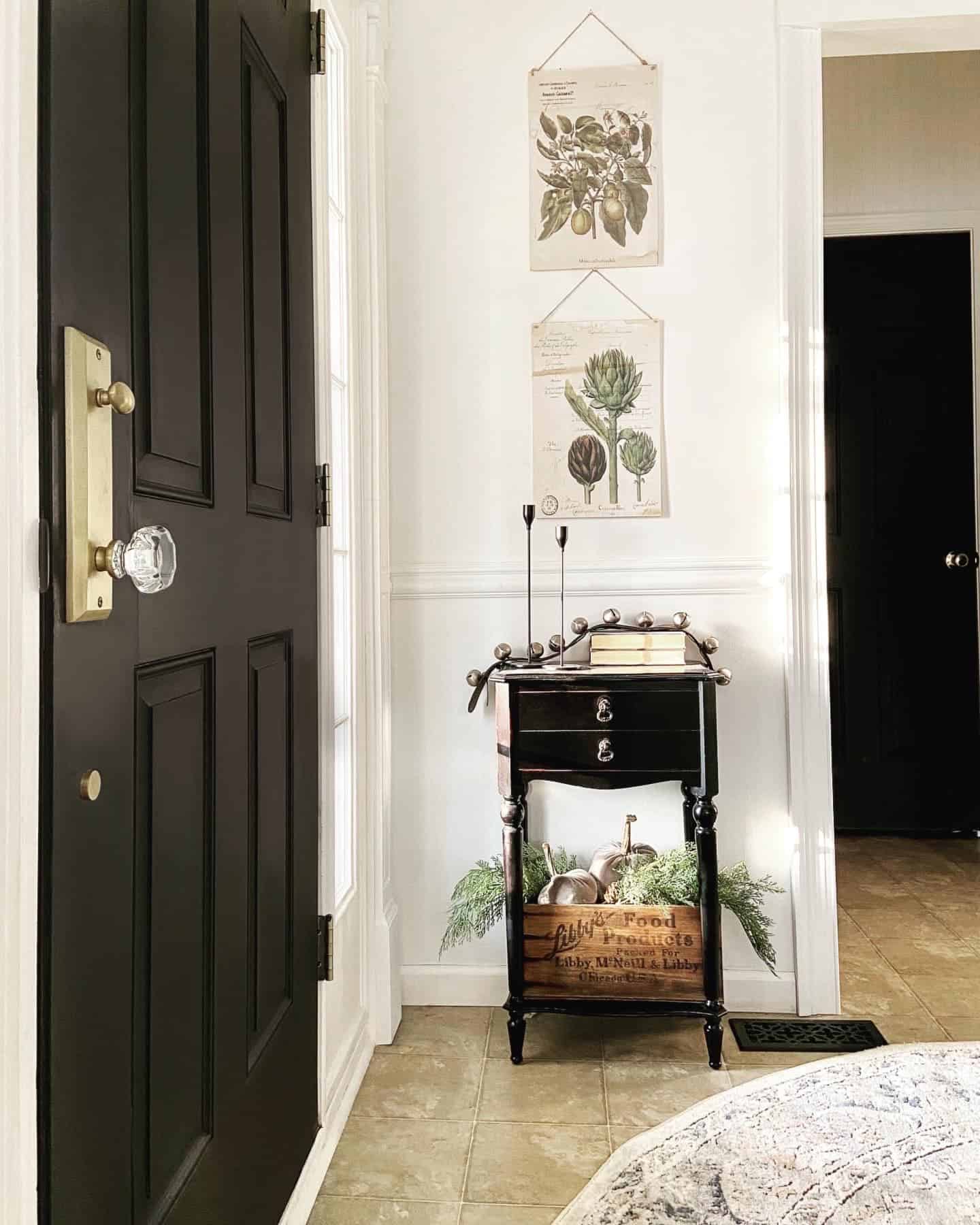 Black door with brass handle interior foyer modern classic Heirloom Traditions Paint Iron Gate